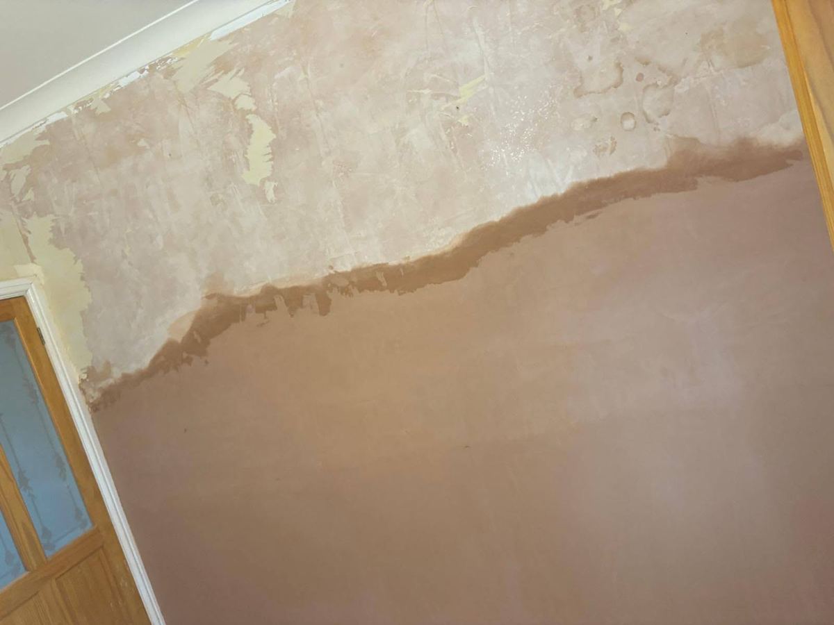 The same wall replastered to a smooth finish