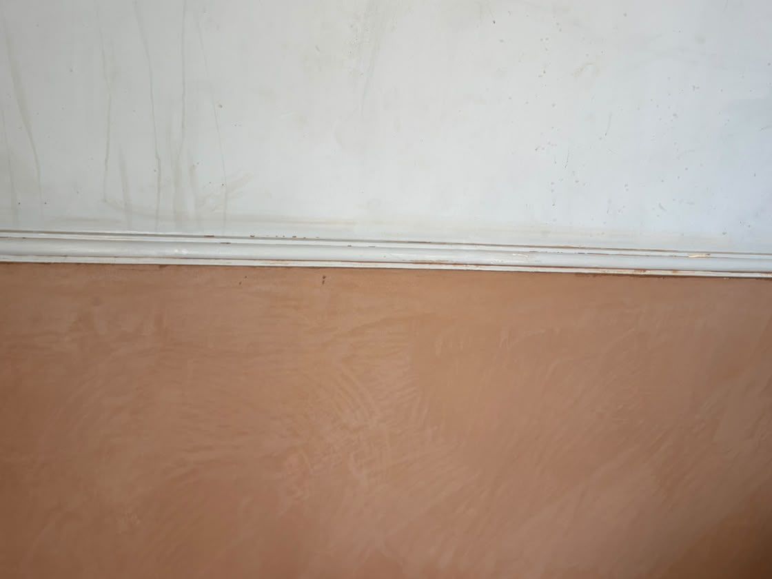 The treated wall replastered to a smooth finish