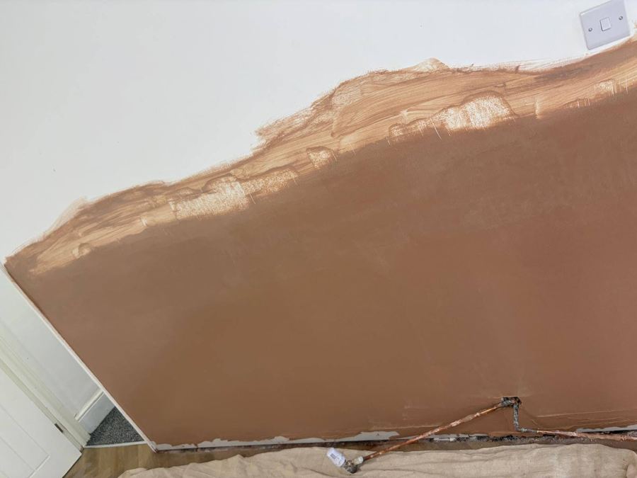 Step 3: wall replastered to a smooth finish, ready for decorating