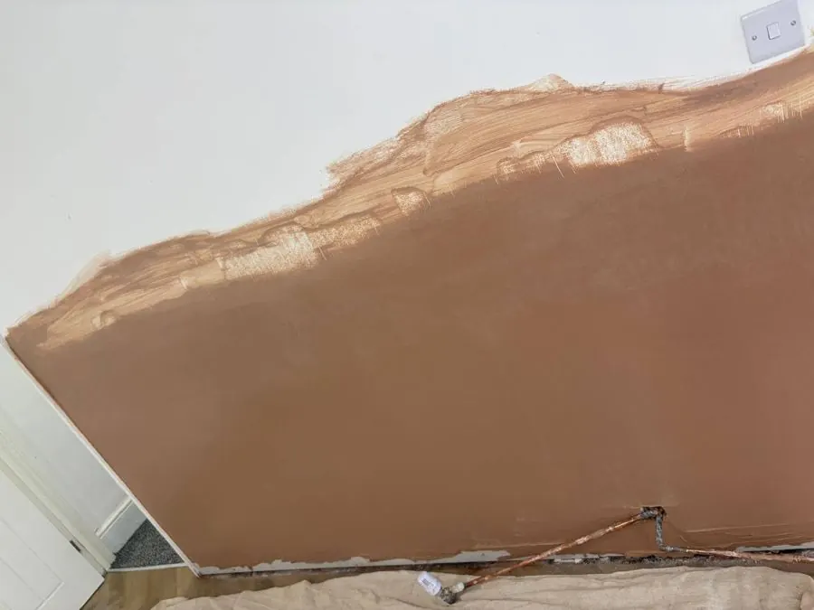 Step 3: wall replastered to a smooth finish, ready for decorating